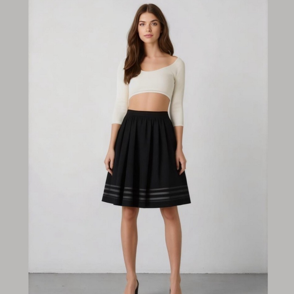 Black skirt. Striped sheer bottom. Medium